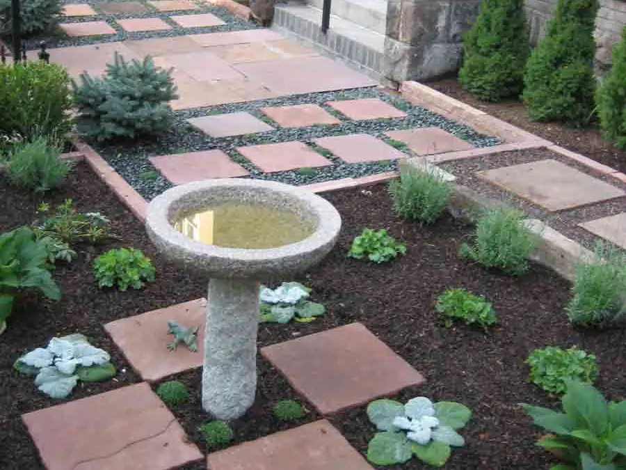 Bird bath and checkerboard flagstone in the English Garden